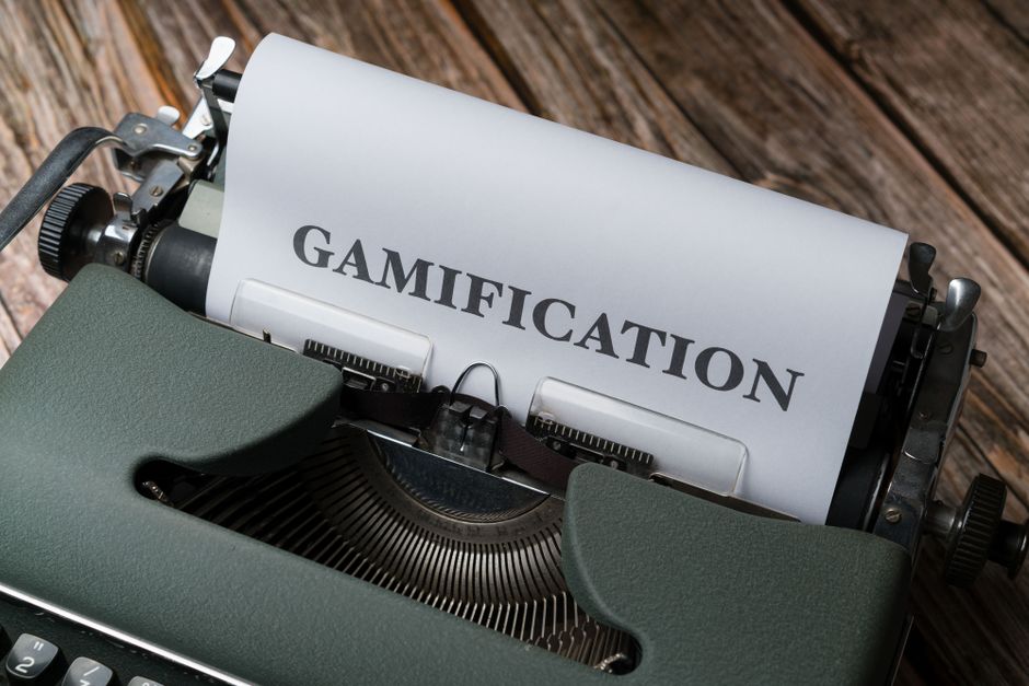 Close-up of a vintage typewriter with 'Gamification' typed on paper, emphasizing game-based concepts.